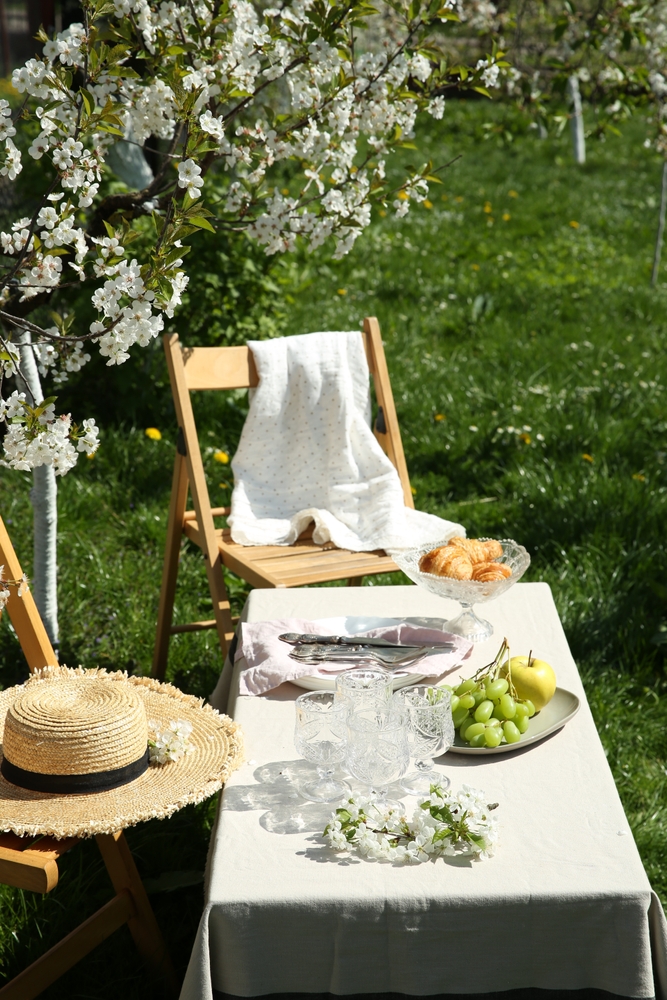 Stylish,Table,Setting,With,Beautiful,Spring,Flowers,In,Garden,On