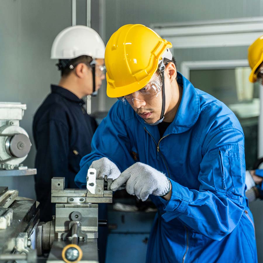 Machinist working in a factory.
